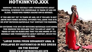 Giant penis from mrHankey anal & prolapse by Hotkinkyjo in red dress on the rocks